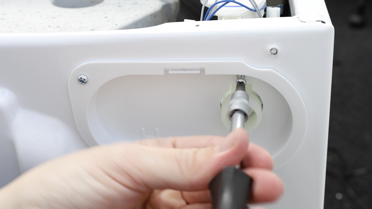 Remove screw holding valve in place